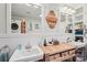 Bright bathroom featuring dual sinks, custom vanities, and well-lit mirrors with a washer and dryer nearby at 3770 Buck Point Rd, Catawba, NC 28609