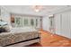 Bright bedroom features wood floors, access to a private balcony, and a closet with full length mirror at 3770 Buck Point Rd, Catawba, NC 28609