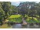 Picturesque view of the house, lush lawn, above ground pool, storage shed and private lake access at 3770 Buck Point Rd, Catawba, NC 28609