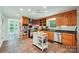 Spacious kitchen with stainless appliances, tile floors, butcher block island, and a view to the outdoor living area at 3770 Buck Point Rd, Catawba, NC 28609