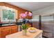 Well-lit kitchen with stainless steel appliances, wooden cabinets, and an island workspace at 3770 Buck Point Rd, Catawba, NC 28609