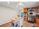 Bright kitchen showcasing stainless steel appliances, tile flooring, and a mobile kitchen island with butcher block top at 3770 Buck Point Rd, Catawba, NC 28609