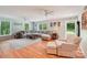 Inviting living room with a large sectional sofa, hardwood floors, and lots of natural light at 3770 Buck Point Rd, Catawba, NC 28609