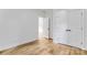 Bright, open bedroom with hardwood floors, double doors, and ample natural light at 7 S Coulter Ave, Newton, NC 28658