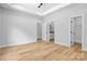 Bright bedroom with wood-look floors, recessed lighting, and ensuite bathroom access at 7 S Coulter Ave, Newton, NC 28658