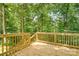 Wooden deck surrounded by lush greenery, offering a serene outdoor space at 7 S Coulter Ave, Newton, NC 28658