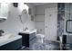Updated bathroom with dual vanities, a toilet, and a beautifully tiled shower at 9232 Chislehurst Rd, Mint Hill, NC 28227