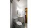 This bathroom boasts a new white vanity, gold fixtures, and an updated toilet at 9232 Chislehurst Rd, Mint Hill, NC 28227