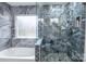 Elegantly tiled bathroom featuring a glass shower, soaking tub, and modern fixtures at 9232 Chislehurst Rd, Mint Hill, NC 28227