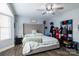 Cozy bedroom with a plush, tufted headboard and a ceiling fan at 9232 Chislehurst Rd, Mint Hill, NC 28227