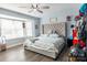 Comfortable bedroom with a large bed, natural light, and modern decor at 9232 Chislehurst Rd, Mint Hill, NC 28227