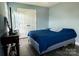 This bedroom offers neutral paint and floors with a double door closet and television at 9232 Chislehurst Rd, Mint Hill, NC 28227
