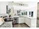 Modern kitchen features white cabinets, granite countertops and stainless steel appliances at 9232 Chislehurst Rd, Mint Hill, NC 28227