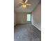 A bright bedroom with carpet flooring, ceiling fan, and lots of natural light at 3320 Hunting Wood Ct, Gastonia, NC 28052