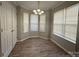 An elegant dining area featuring laminate floors, updated lighting, and windows at 3320 Hunting Wood Ct, Gastonia, NC 28052