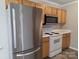 Well-equipped kitchen with stainless steel refrigerator and built-in microwave at 3320 Hunting Wood Ct, Gastonia, NC 28052