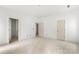 Spacious bedroom offers a clean design with neutral paint, multiple doors, and flooring ready for finishing touches at 4615 Yellow Poplar Ln, Concord, NC 28025