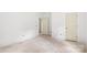 Bright room featuring white walls, unfinished flooring, and neutral doors for a peaceful and inviting space at 4615 Yellow Poplar Ln, Concord, NC 28025