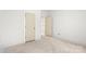 A bright bedroom with clean white walls, unfinished flooring, and neutral doors, offering a peaceful ambiance at 4615 Yellow Poplar Ln, Concord, NC 28025