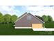 A home featuring gray sidings, lush green lawn, and an attached garage at 4615 Yellow Poplar Ln, Concord, NC 28025