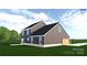 A gray home exterior featuring dark roofing and lush green lawn at 4615 Yellow Poplar Ln, Concord, NC 28025