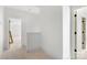 Bright hallway with white walls and trim and multiple doorways at 4615 Yellow Poplar Ln, Concord, NC 28025