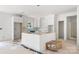 Unfinished kitchen with white cabinets, island, and an open layout at 4615 Yellow Poplar Ln, Concord, NC 28025