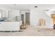 Open concept kitchen area with white cabinets and unfinished flooring at 4615 Yellow Poplar Ln, Concord, NC 28025