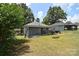 Expansive backyard with a patio, lush greenery, and a peaceful ambiance at 502 Allison Nw St, Concord, NC 28025