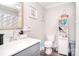 Bathroom featuring a vanity, toilet, and shower with decorative curtain at 502 Allison Nw St, Concord, NC 28025