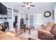 Cozy living room with wood floors, comfortable seating, and natural light at 502 Allison Nw St, Concord, NC 28025