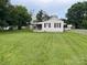 A sprawling lawn surrounds this home, offering ample space for outdoor enjoyment at 104 Franklin St, Clover, SC 29710