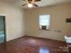 A cozy bedroom with a ceiling fan, laminate floors, and an air conditioner at 104 Franklin St, Clover, SC 29710