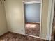 A room with light walls and patterned carpet seen through the doorway at 104 Franklin St, Clover, SC 29710