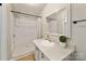 Bright bathroom featuring a shower-tub combo and a modern single sink vanity with neutral countertops at 1354 Springwood Ln, Rock Hill, SC 29730