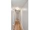 Hallway with light gray walls and wood-look floors, illuminated by overhead lighting at 1354 Springwood Ln, Rock Hill, SC 29730