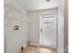 A functional laundry room with storage shelves and convenient access to the outdoors at 1354 Springwood Ln, Rock Hill, SC 29730