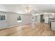 Open concept living room and kitchen with natural light and hardwood floors at 1354 Springwood Ln, Rock Hill, SC 29730