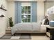 Charming bedroom showcasing decorative accents, a comfortable bed, and natural light at 1606 Swallow Tail Dr, Cramerton, NC 28012
