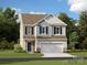 Charming two-story home featuring a blend of siding, brick accents, and a two-car garage at 1606 Swallow Tail Dr, Cramerton, NC 28012