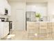 Modern kitchen with white cabinets, stainless steel appliances, and bar stool seating at the island at 1606 Swallow Tail Dr, Cramerton, NC 28012