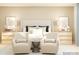 Neutral bedroom showcases bedside tables, modern lamps, inviting chairs, and a comfortable upholstered bed at 1606 Swallow Tail Dr, Cramerton, NC 28012