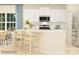 Modern kitchen with stainless steel appliances, white cabinetry, and breakfast bar seating at 1613 Swallow Tail Dr, Cramerton, NC 28012