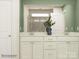Bathroom with dual sinks, granite countertops, and decorative accents at 1616 Swallow Tail Dr, Cramerton, NC 28012