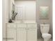 Bright bathroom with a neutral vanity, framed artwork, and classic toilet for a clean aesthetic at 1616 Swallow Tail Dr, Cramerton, NC 28012