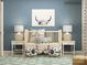 Charming Bedroom with a wooden crib, cow-print ottomans, and soft lighting for a peaceful atmosphere at 1616 Swallow Tail Dr, Cramerton, NC 28012