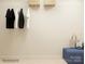 Organized closet with hanging clothes, overhead shelving, and a storage bench at 1616 Swallow Tail Dr, Cramerton, NC 28012