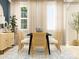 Bright dining area with large windows, modern furniture, and decorative accents at 1616 Swallow Tail Dr, Cramerton, NC 28012