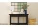 A hallway table is decorated with a lamp, vase, and stylish decor at 1616 Swallow Tail Dr, Cramerton, NC 28012