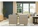 A contemporary living room with modern seating and large windows at 1616 Swallow Tail Dr, Cramerton, NC 28012